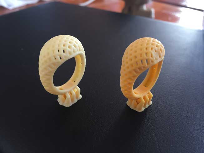 Our two test ring prints. The one on the right has a small dent because we took it off the build platform with our fingers instead of the scraper